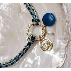 Bracelet réglable composé de breloques en tagua, acier inoxydable et nacre