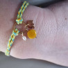 Bracelet réglable composé de breloques en tagua, couleur jaune, et breloque au choix en acier inoxydable